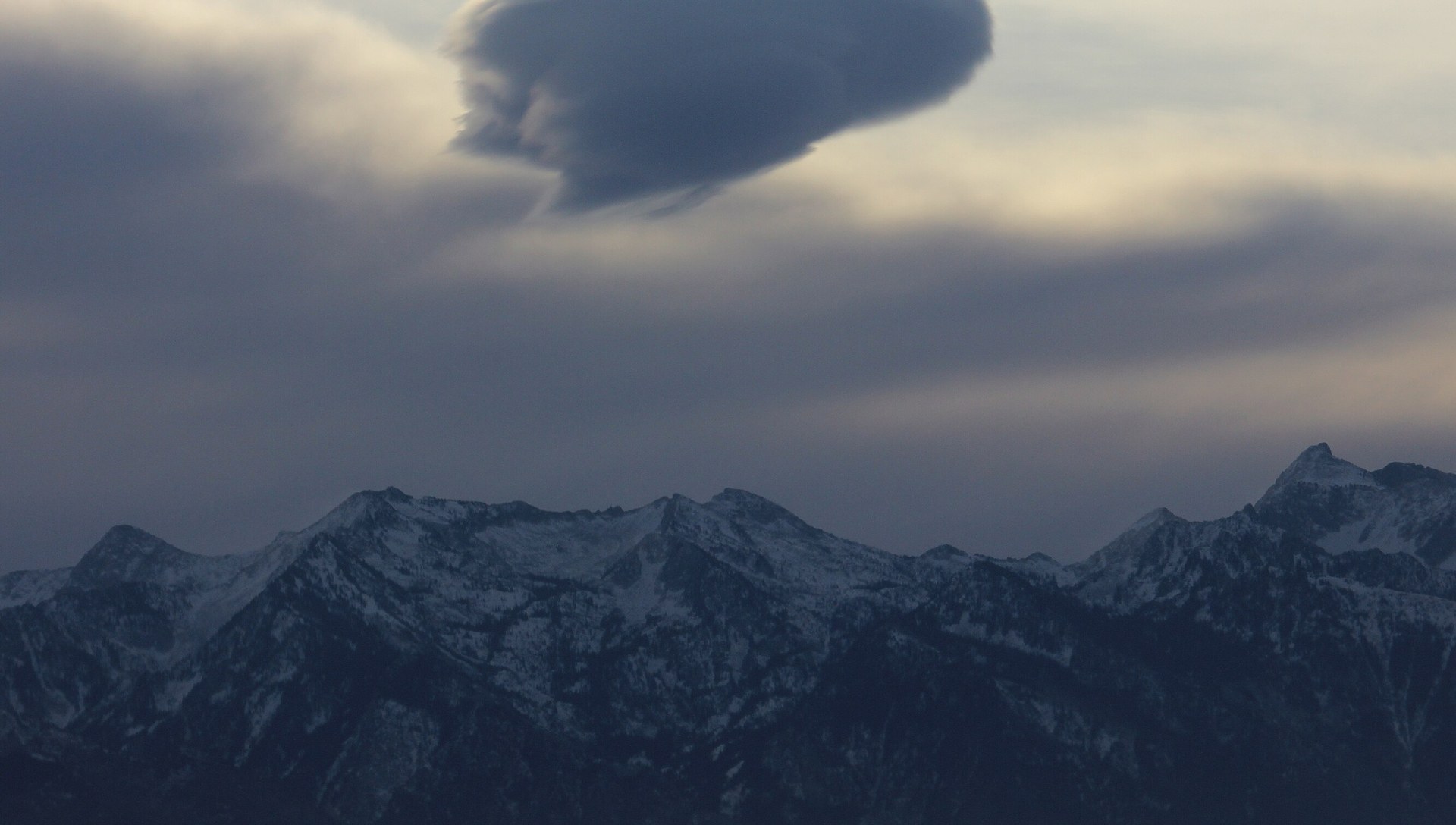 The Wasatch Range under a lenticular storm cloud over Utah County